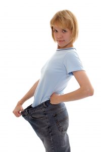 Slim girl in big size jeans